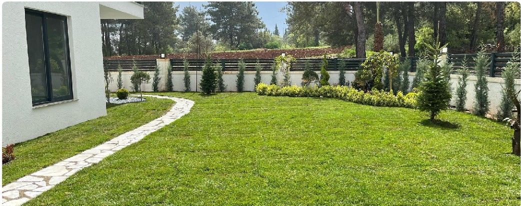 Natural stone walkway across a lawn