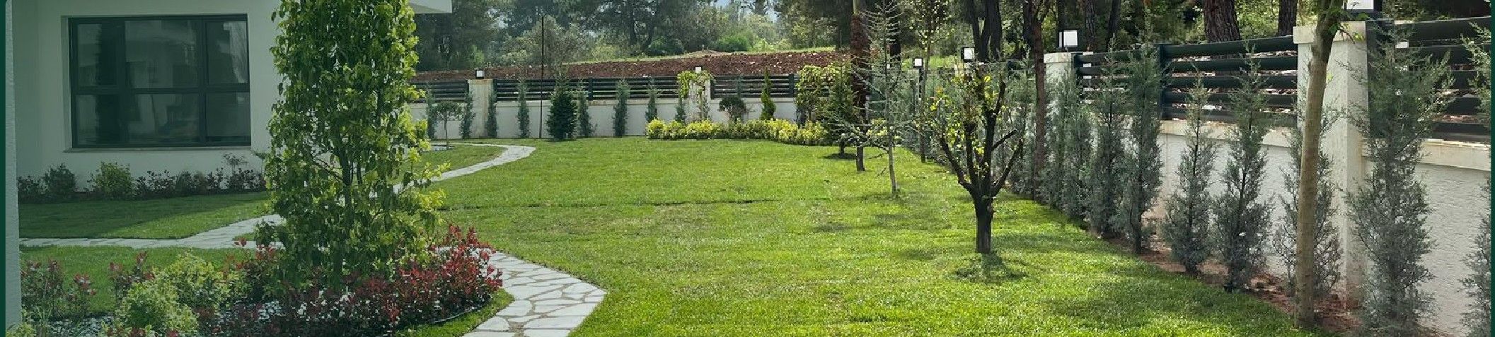 Garden application with planned planting and a natural stone walkway